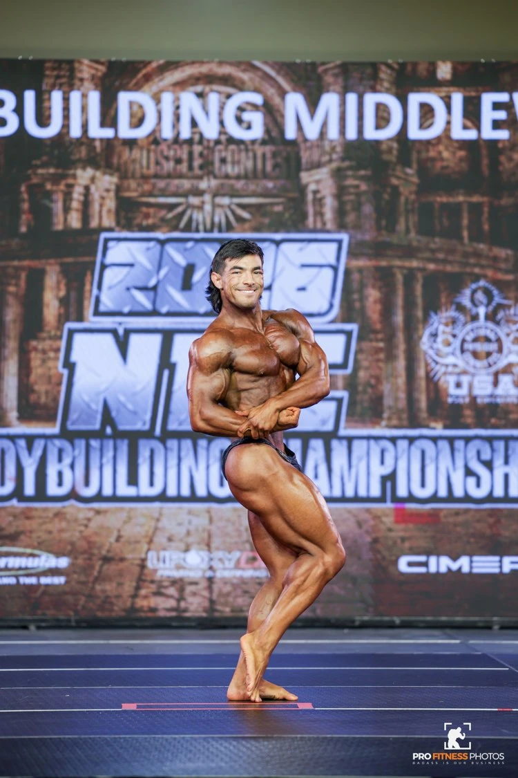 Zack Granly side chest pose in Men's Bodybuilding Middleweight at the 2026 NPC USA Championships