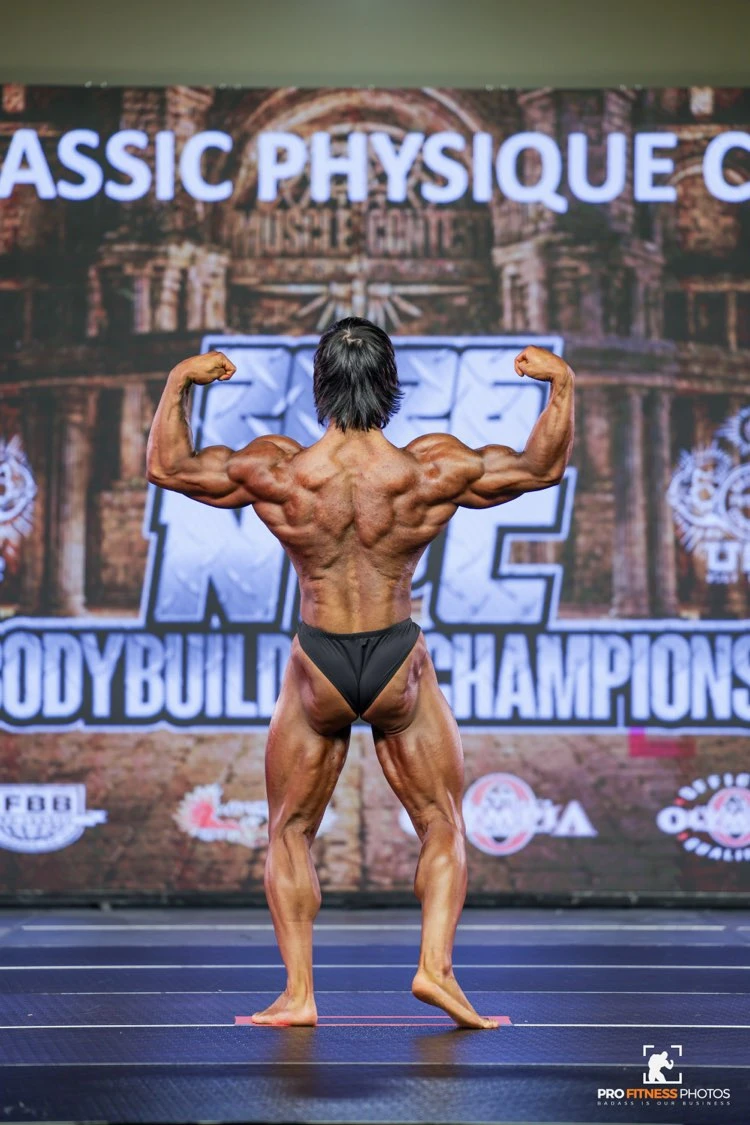 Zack Granly back double biceps in Classic Physique at the 2026 NPC USA Championships