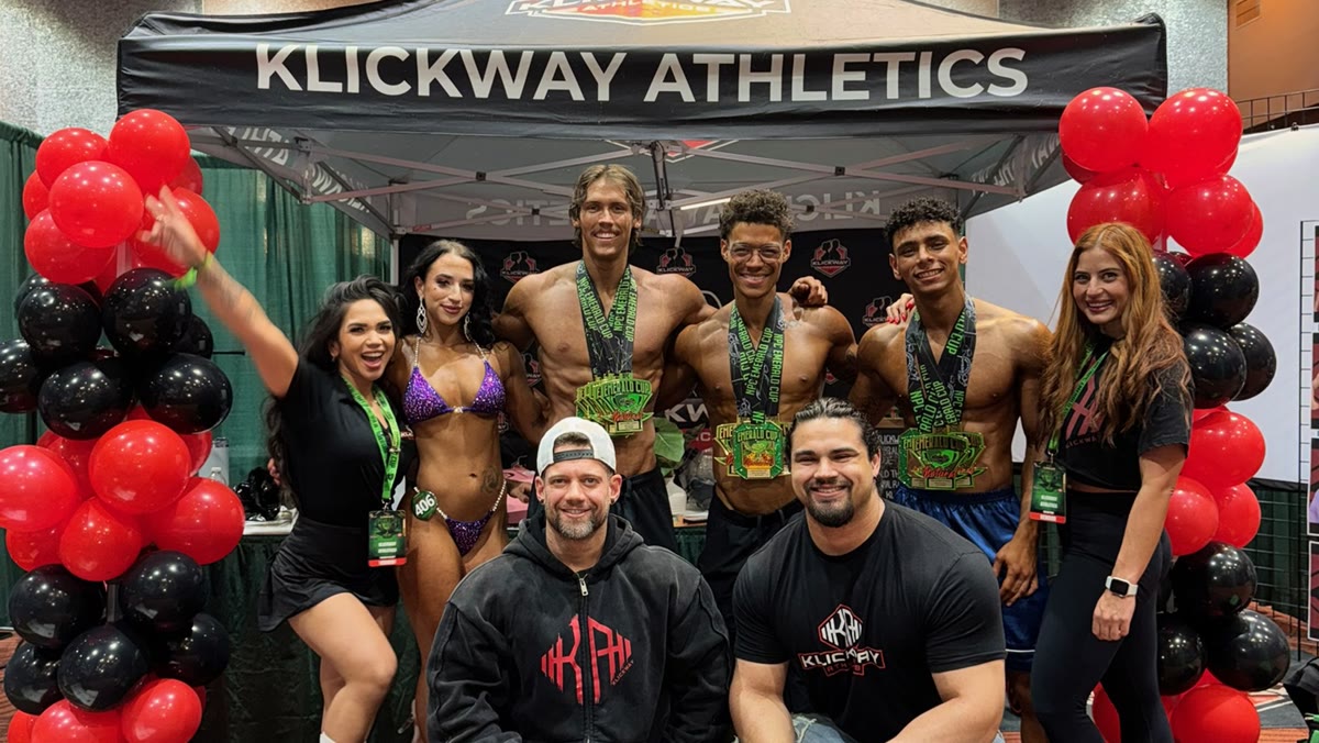 KlickWay athletes and coaches with their medals at the NPC Emerald Cup booth